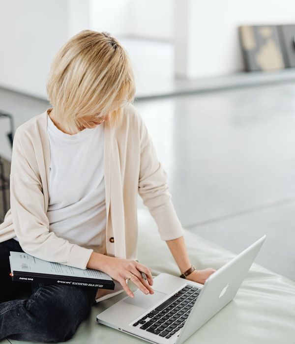 Woman feeling energized and balanced in a bright, open space.